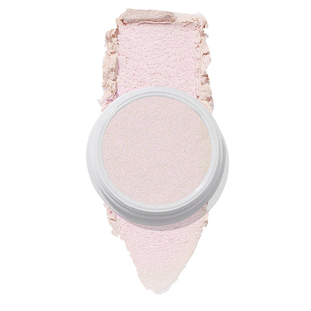 ColourPop Monster Super Shock Highlighter shown in an open white pot with a broad smear swatch behind it, revealing a silky pale pink, iridescent pearl glow, isolated on a clean white background.