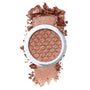 ColourPop Sequin Super Shock Shadow, a shimmering rose-gold eyeshadow, rests in a white round pot with a honeycomb imprint, shown partially crushed and swatched to display its metallic glitter payoff on a clean white background.