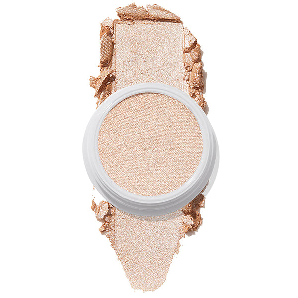 ColourPop Super Shock Highlighter Flexitarian swatched in a reflective icy champagne tone, the creamy formula pressed in a white pot with a bold swipe above and below on a white background, showing high-impact shimmer.