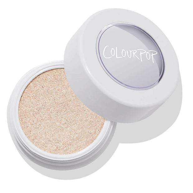ColourPop Super Shock Highlighter in Flexitarian opens to reveal a pearly pale champagne shimmer in a round white pot with a clear logo lid, resting on a clean white background.