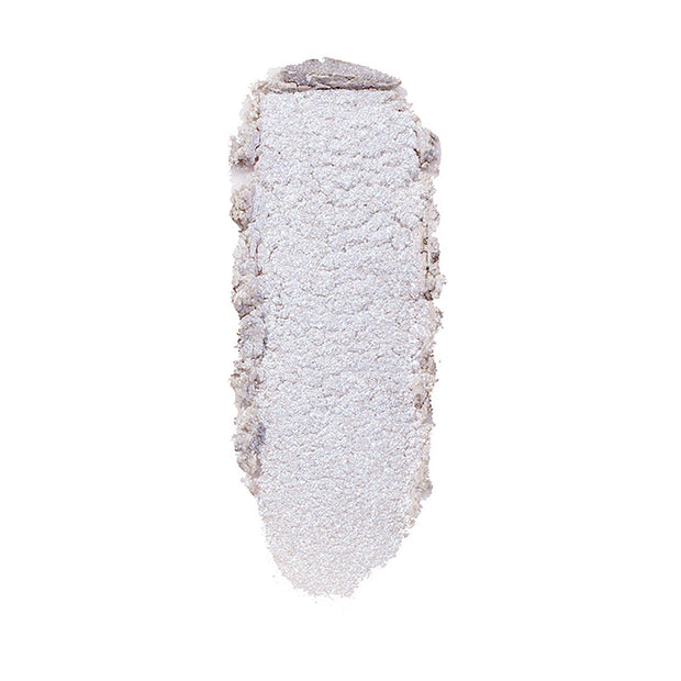 ColourPop Honeymoon Super Shock Highlighter swatch catching light as a long, oval smear of icy silver‑lavender shimmer with soft, crumbly edges, shown isolated on a clean white background.