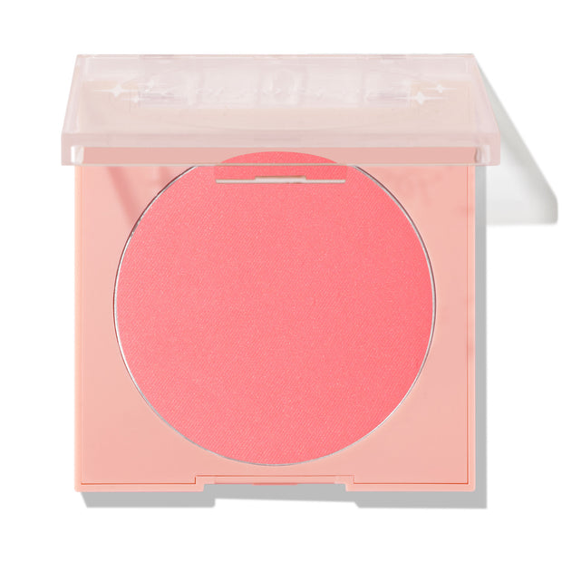 Big Reveal pressed powder blush showing a vibrant coral‑pink pan set in a pale peach square compact with a clear lid slightly open on a white background; ColourPop Pressed Powder Blush for cheeks.