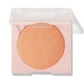 Boombox ColourPop Pressed Powder Highlighter displays a warm peach-gold shimmer pan in a pale pink compact with a half-open clear lid on a white background.