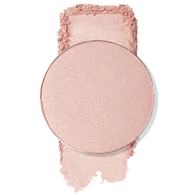 Round pan of Easy Livin' highlighter catching light as fine shimmer dusts above and below, revealing a soft champagne‑pink sheen on a white background; ColourPop Pressed Powder Highlighter Single for a luminous glow.
