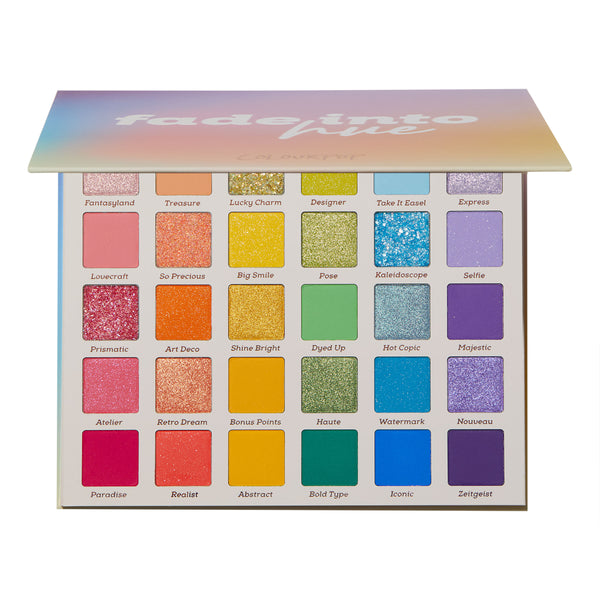 Fade Into Hue ColourPop Shadow Palette shows an open 30-pan rainbow layout - mattes, shimmers, and pressed glitters - from pink to purple with labeled shades like Fantasyland and Kaleidoscope, under a pastel gradient lid.