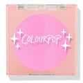 ColourPop Pressed Powder Blush in Flamingo shows a vibrant hot pink pan inside a square peach compact with a clear lid and white sparkles logo, closed and travel-friendly on a light background.