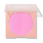 Flamingo shade shown in a peach square compact with a translucent lid half closed, revealing a bright bubblegum pink ColourPop Pressed Powder Blush pan on a white background with a soft shadow.
