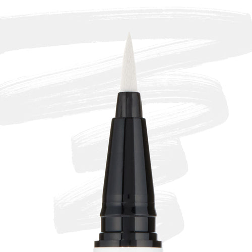 ColourPop BFF Liquid Liner Graceland creating bold white strokes with a fine felt tip; close-up of the black pen barrel and pointed brush, white eyeliner swatches behind, for precise wings and graphic eye looks.