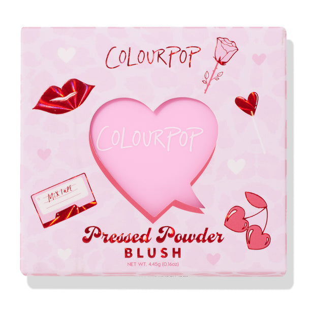 Hot 2 Touch ColourPop Pressed Powder Blush showcased in a pink, Valentine-themed box with a heart-shaped window and red lips, rose, heart lollipop, and cherry graphics; front reads Pressed Powder Blush; 4.45 g (0.16 oz).