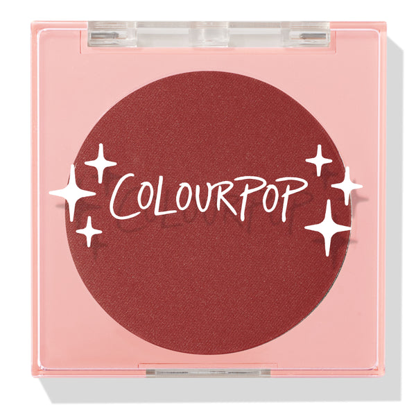 Icing on Top pressed powder blush compact closed, featuring a deep berry pan behind a clear lid with white ColourPop logo and star accents, housed in a pale pink square case on a white background; ColourPop Pressed Powder Blush.