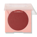 Icing on Top ColourPop Pressed Powder Blush, a deep berry matte pressed powder, sits in a peach square compact with a translucent lid half closed against a white studio background.