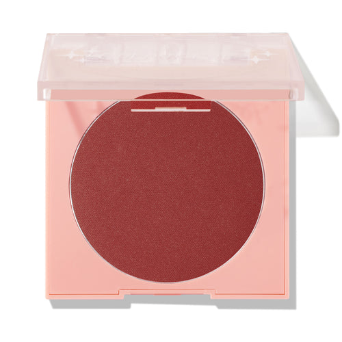 Icing on Top ColourPop Pressed Powder Blush, a deep berry matte pressed powder, sits in a peach square compact with a translucent lid half closed against a white studio background.