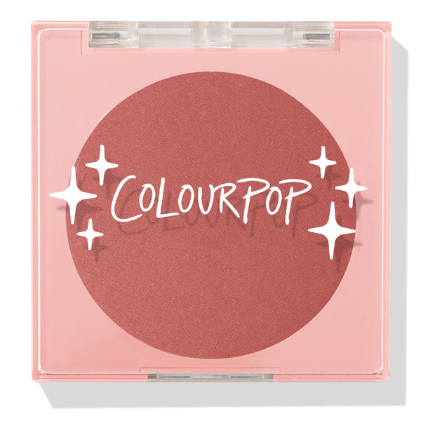 Just Cruisin’ ColourPop Pressed Powder Blush shown closed in a pink square compact with a clear lid and white sparkles logo, revealing a matte warm rose terracotta pan on a clean white background.