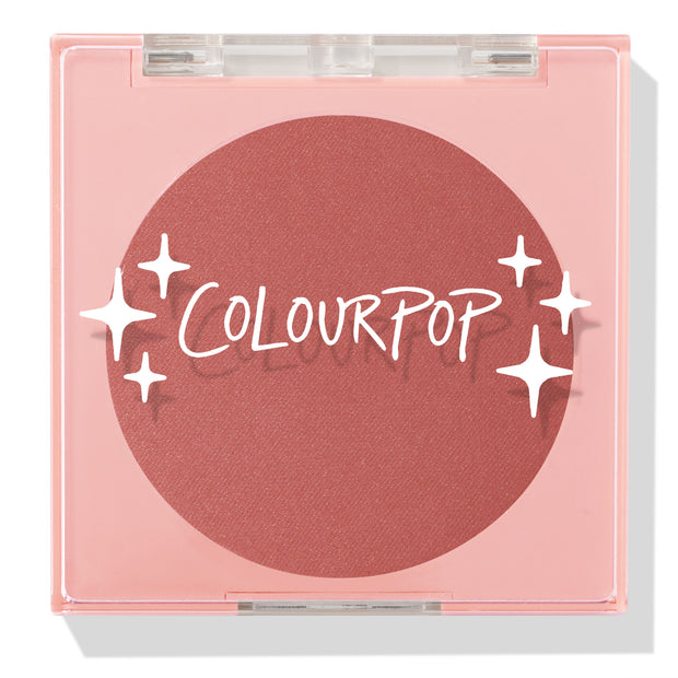 Just Cruisin’ ColourPop Pressed Powder Blush shown closed in a pink square compact with a clear lid and white sparkles logo, revealing a matte warm rose terracotta pan on a clean white background.