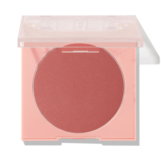 ColourPop Pressed Powder Blush in Just Cruisin' opens to reveal a large matte rose pan in a peach square compact with a clear lid half-closed, shown in a clean studio shot on white.