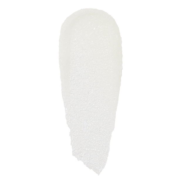 Translucent white, sugar-granule swatch of Just One Bite ColourPop Lip Scrub, smeared in a single elongated swipe with fine crystals catching light on a clean white background.