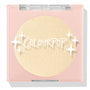 Minted pressed powder highlighter compact showcasing a shimmering champagne-gold pan, closed in a blush-pink square case with clear lid and ColourPop logo and star accents on a white background; ColourPop Pressed Powder Highlighter.