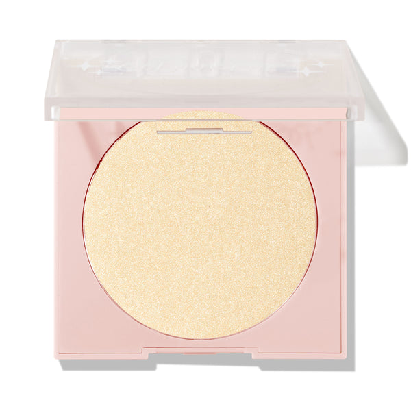 Minted pressed powder highlighter sitting half-open, displaying a large circular pan of pale gold shimmer in a blush-pink compact with a clear lid; ColourPop Pressed Powder Highlighter shade Minted for a luminous glow.