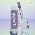 Same Vibe ColourPop Chrome Liquid Shadow displayed open with a doe-foot applicator leaning on the clear, star-printed cap; the liquid shows a purple-to-teal multichrome shimmer, white COLOURPOP logo visible, on a pastel gradient backdrop marked NEW!