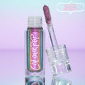 Supernova ColourPop Chrome Liquid Shadow shown open, a clear tube with multi-chrome teal‑purple‑gold shift and a doe-foot applicator coated in sparkly fuchsia, set on a pastel blue‑to‑lavender backdrop with a “Colour Shifting” callout.