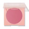 New to U ColourPop Pressed Powder Blush compact displaying a rosy pink pan, lid half-open on a peach square case with a clear top, photographed against a white studio background with a soft shadow.