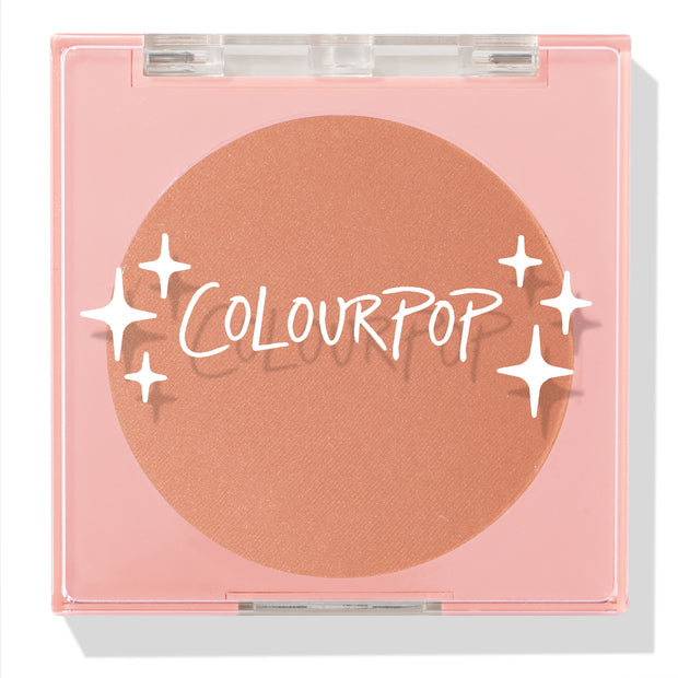 No Rules ColourPop Pressed Powder Blush displays a warm peach pan in a pink square compact with a clear lid, white ColourPop logo, and star sparkles, shown closed against a white background.