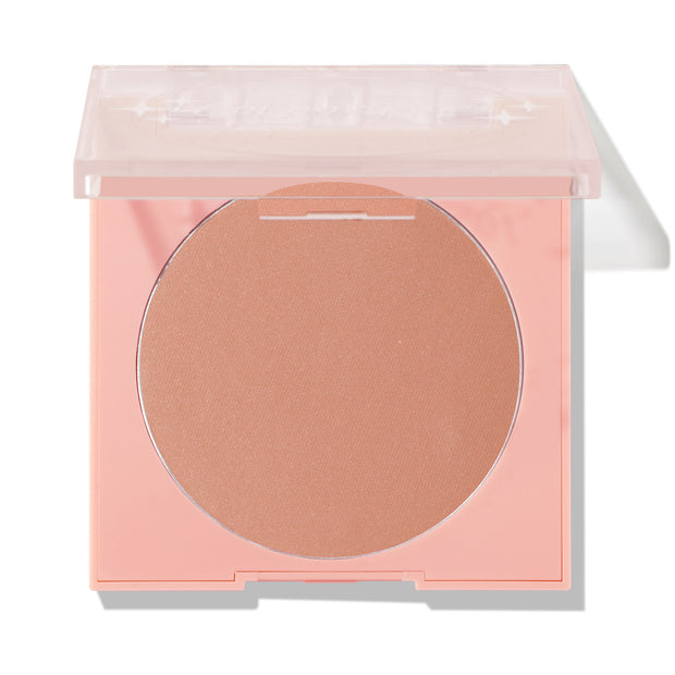 Out & About ColourPop Pressed Powder Blush showcases a warm peachy nude matte shade in a soft pink square compact, its clear lid half-open, on a white studio background.