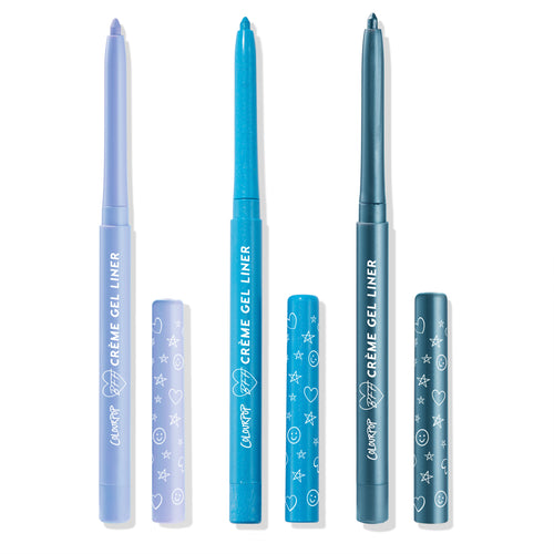 Out of the Blue ColourPop Crème Gel Liner trio stands uncapped, showing retractable tips in pastel periwinkle, vivid turquoise, and deep teal; matching printed caps with stars, hearts, and smileys sit beside them on a white background.