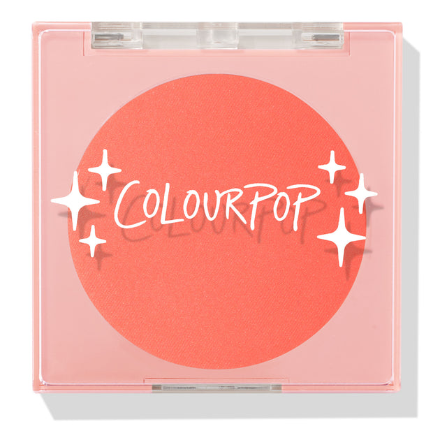 Papaya pressed powder blush sits as a vivid coral pan in a closed translucent pink square compact, featuring the COLOURPOP logo and white star accents; ColourPop Pressed Powder Blush for a warm, bright cheek flush.