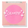 Prairie Air ColourPop Pressed Powder Blush compact sits closed, displaying a vibrant bubblegum pink pan beneath a clear lid with white sparkle icons and the ColourPop logo, housed in a peach square case on a white background.