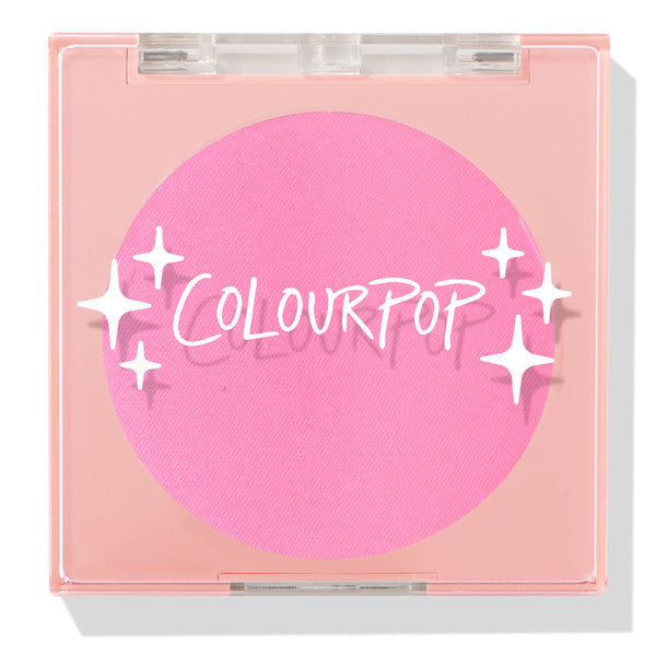 Prairie Air ColourPop Pressed Powder Blush compact sits closed, displaying a vibrant bubblegum pink pan beneath a clear lid with white sparkle icons and the ColourPop logo, housed in a peach square case on a white background.