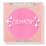 Prairie Air ColourPop Pressed Powder Blush compact sits closed, displaying a vibrant bubblegum pink pan beneath a clear lid with white sparkle icons and the ColourPop logo, housed in a peach square case on a white background.