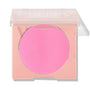 Prairie Air ColourPop Pressed Powder Blush presenting a vivid cool‑toned pink round pan in a pastel peach square compact with a clear, half‑closed lid, shown against a white background for a clean product shot.