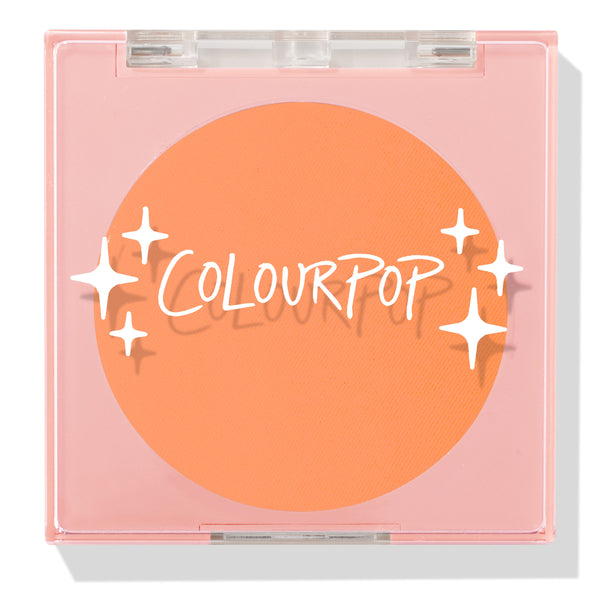 Roxbury Dr ColourPop Pressed Powder Blush compact showing a bright tangerine shade, closed in a pink square case with a clear lid and white star graphics.
