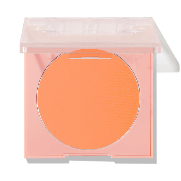Roxbury Dr ColourPop Pressed Powder Blush compact showing a matte peach-orange pan, lid half-closed, in a light pink square case with clear top on a white background.