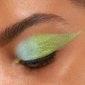 Closed eye showcases See U Later Chrome Liquid Shadow, a ColourPop Chrome Liquid Shadow, blended from icy mint to lime green with a metallic shift and sharp winged edge, highlighting lashes and brow area in a tight close-up.