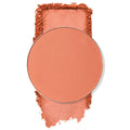 Shortbread pressed powder blush pan showing a warm peach hue, the ColourPop Pressed Powder Blush Single swatched as a soft pigment smear around the round tin, studio shot on a white background to highlight texture and color payoff.