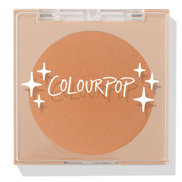 ColourPop Pressed Powder Bronzer in Silver Strand Beach, a warm tan matte shade, shown closed in a square clear compact with white ColourPop logo and star accents on the lid, displaying the full round pan in a sleek beige case.