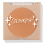 ColourPop Pressed Powder Bronzer in Silver Strand Beach, a warm tan matte shade, shown closed in a square clear compact with white ColourPop logo and star accents on the lid, displaying the full round pan in a sleek beige case.