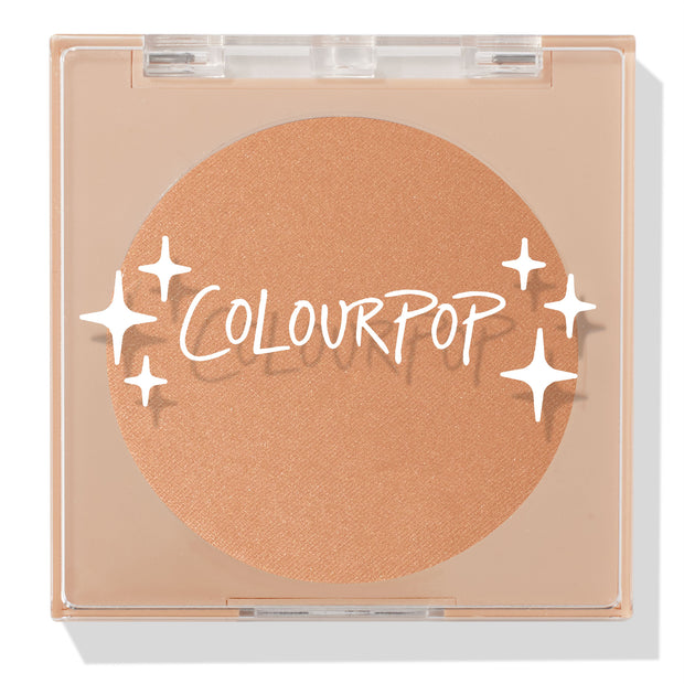 ColourPop Pressed Powder Bronzer in Summerland Beach shown closed, warm golden-tan pan inside a clear square compact with white sparkle graphics and ColourPop logo, set against a clean white background.