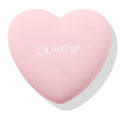 Sweetheart ColourPop Pressed Powder Blush compact rests closed, showing the COLOURPOP logo on a pastel pink heart-shaped case against a white background with a soft shadow.
