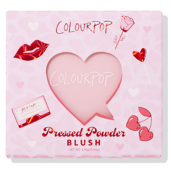 Sweetheart shade ColourPop Pressed Powder Blush sits behind a heart-shaped cutout, showcased in a pink Valentine-themed box with red foil lips, rose, heart lollipop, cherries, and mixtape graphics; 4.45 g (0.16 oz) pan.