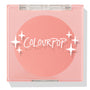 Swirled ColourPop Pressed Powder Blush compact closed, showcasing a warm peach‑coral matte pan beneath a clear pink lid with white starburst logo, square plastic case centered on a white background.