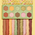 Sweet As Can Bee ColourPop Shadow Palette showing 10 hexagon, honeycomb pans with matching vertical swatches - matte mustard, terracotta, maroon, plus shimmery pink, mint, gold, and olive - set in floral, bee-themed packaging on a yellow background.