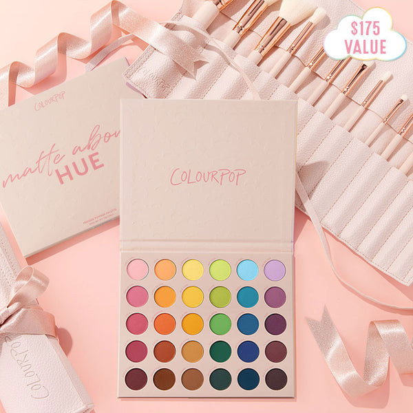 Crazy For Hue ColourPop Shadow Palette & Brush Set showcases an open pastel-pink palette of vibrant matte rainbow eyeshadows as rose-gold brushes rest in a blush roll, styled on a soft pink flat lay with a $175 value badge.